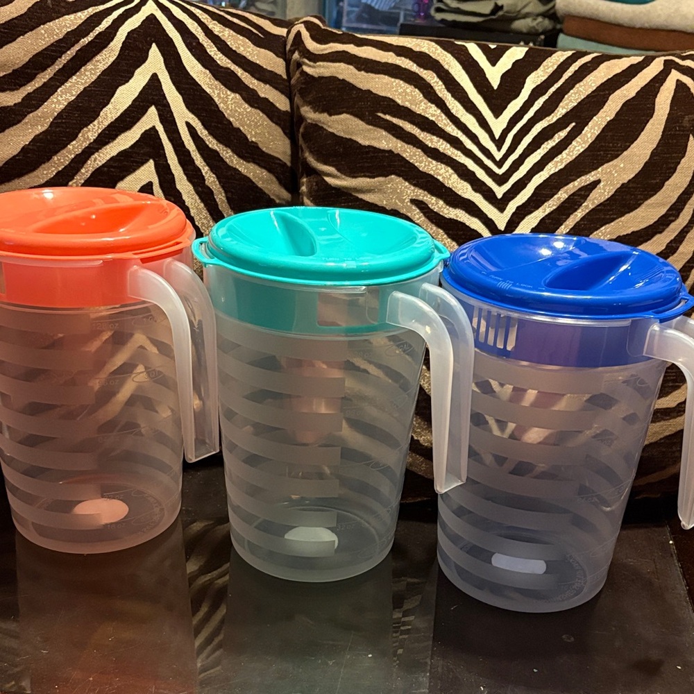 Set of Three Colorful Pitchers with Lids